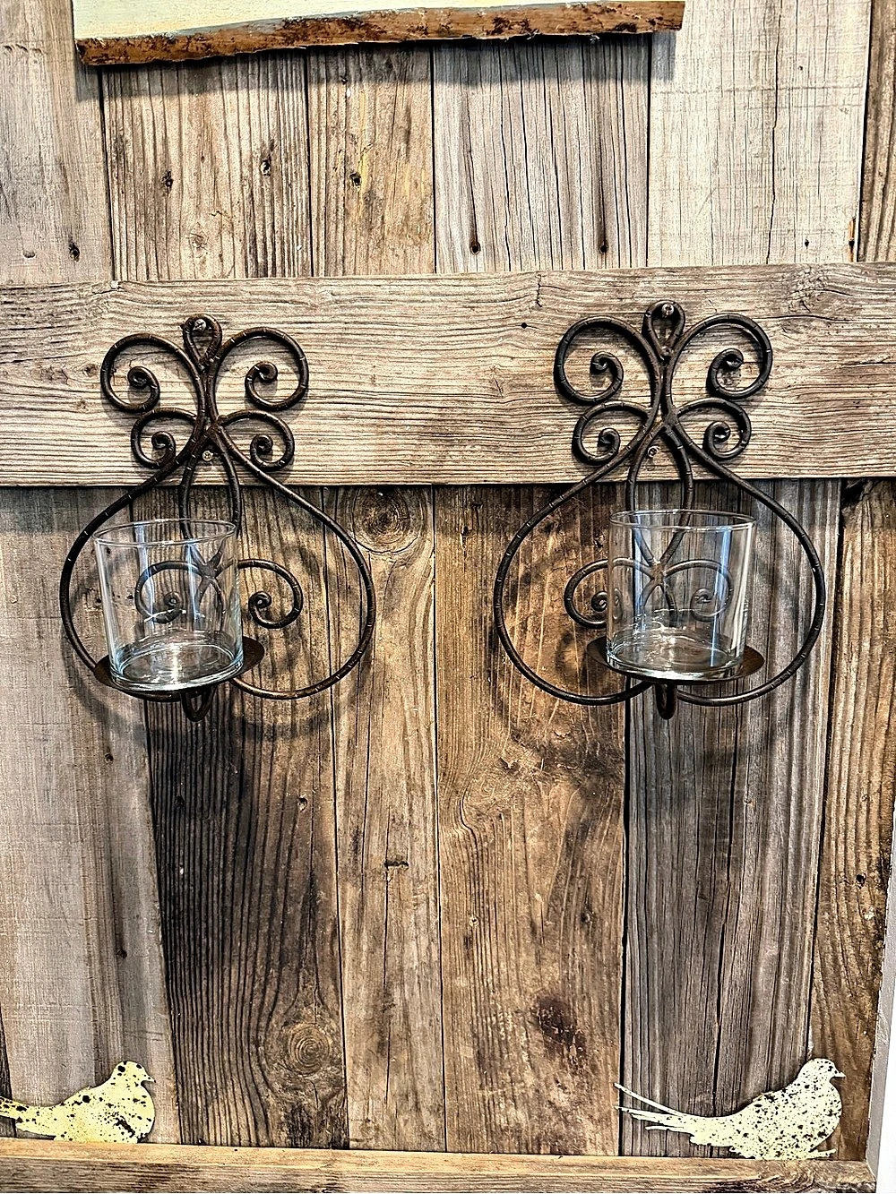 Pair of vintage-style bronze metal and glass wall-mounted candle holders